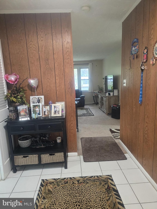 6112 Armor Dr, Clinton, MD 20735 - hallway with wooden walls, tile patterned floors, and baseboards