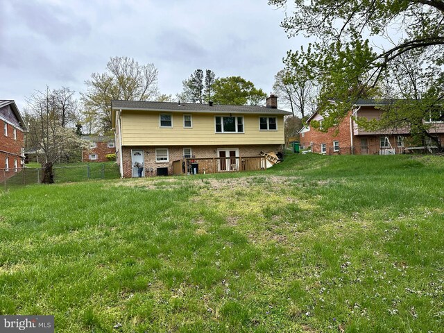 6112 Armor Dr, Clinton, MD 20735 - rear view of property with a chimney and brick siding