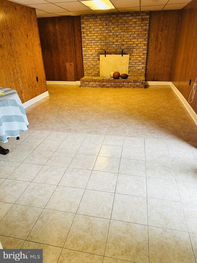 6112 Armor Dr, Clinton, MD 20735 - finished below grade area with wooden walls, a drop ceiling, and baseboards