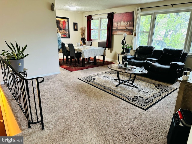 6112 Armor Dr, Clinton, MD 20735 - carpeted living room featuring baseboards, a textured ceiling, and stairs
