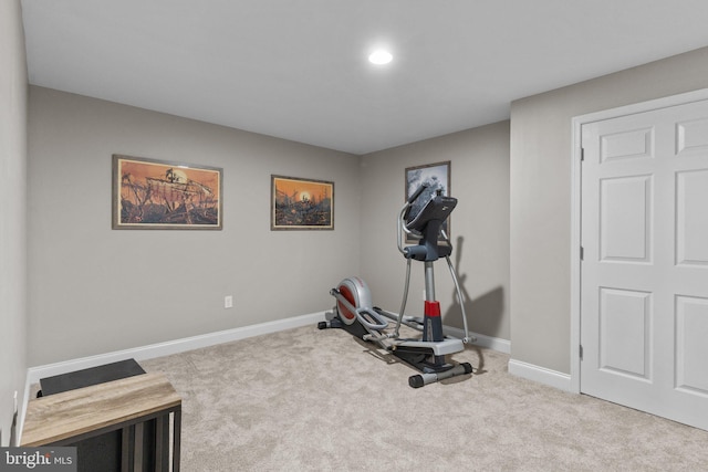 workout room with carpet floors and baseboards