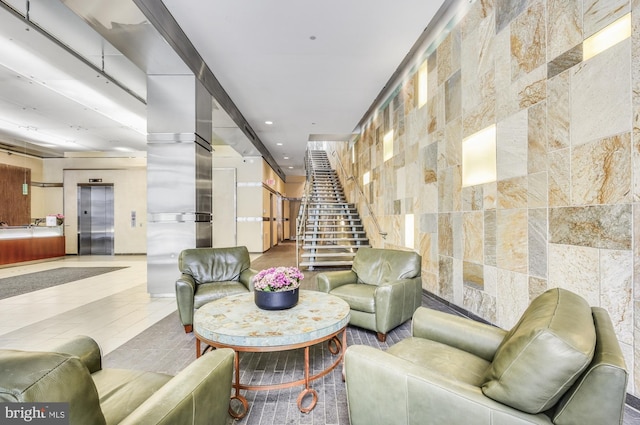 23 S 23rd St Unit 3E, Philadelphia, PA 19103 - building lobby with stairs, recessed lighting, and tile walls