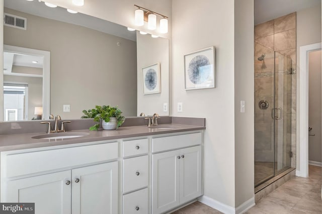 15500 Smoke Box Way, Woodbridge, VA 22191 - bathroom featuring visible vents, a sink, baseboards, and a stall shower