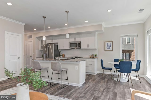15500 Smoke Box Way, Woodbridge, VA 22191 - kitchen featuring visible vents, decorative backsplash, dark wood finished floors, and appliances with stainless steel finishes