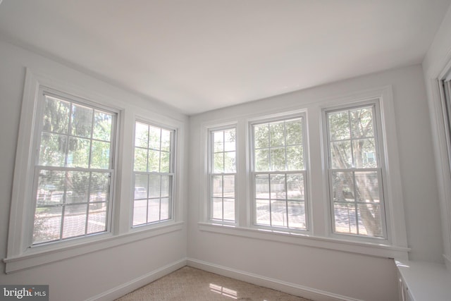 unfurnished sunroom with plenty of natural light