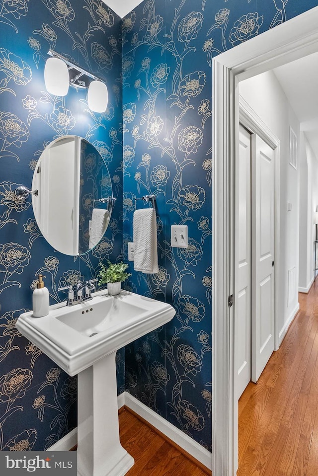 4950 34th St N, Arlington, VA 22207 - bathroom featuring baseboards, wallpapered walls, visible vents, and wood finished floors