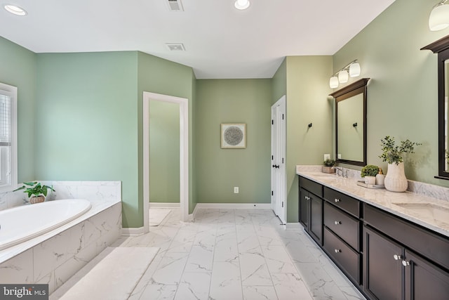 bathroom with a bath, recessed lighting, baseboards, and marble finish floor