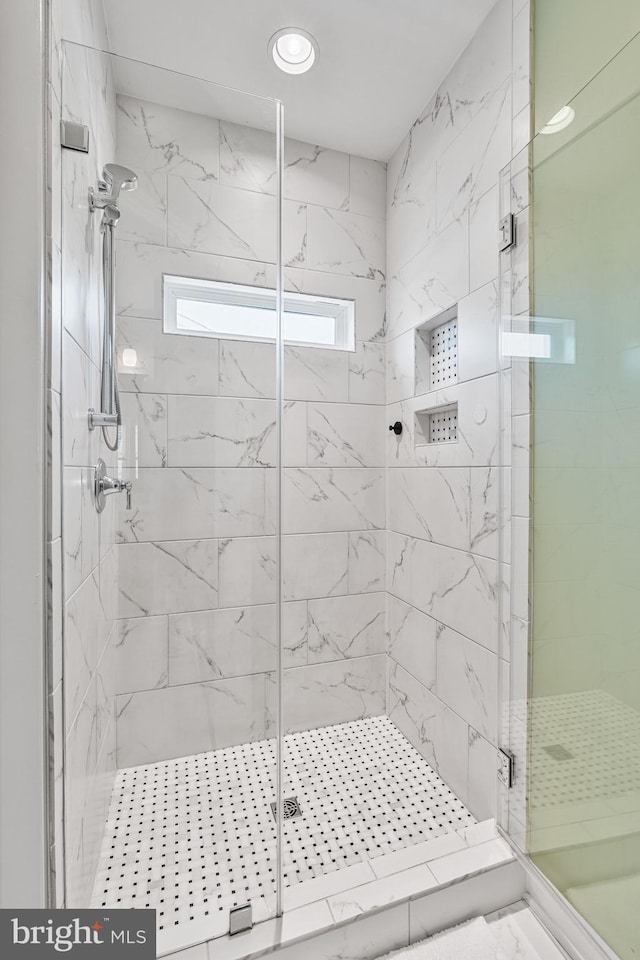 bathroom with a stall shower, recessed lighting, and marble finish floor