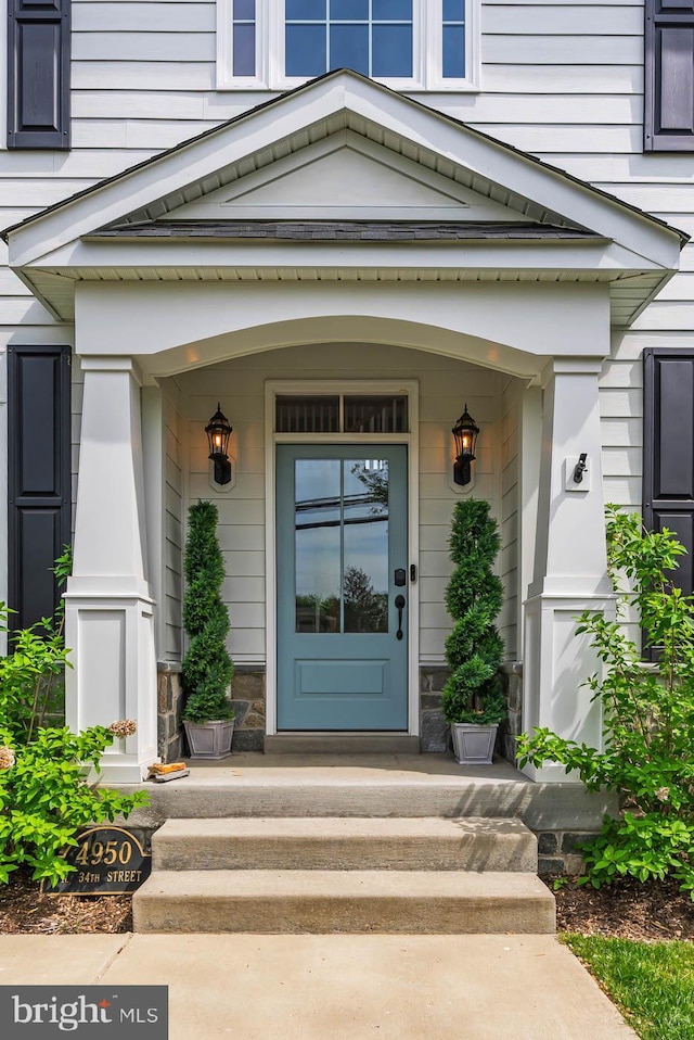 4950 34th St N, Arlington, VA 22207 - doorway to property with covered porch and stone siding
