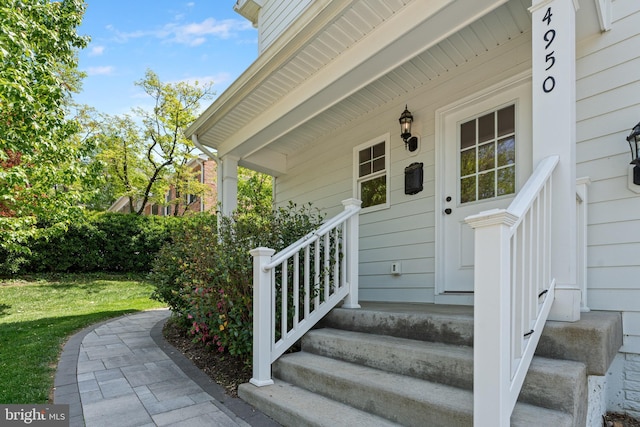 entrance to property featuring covered porch