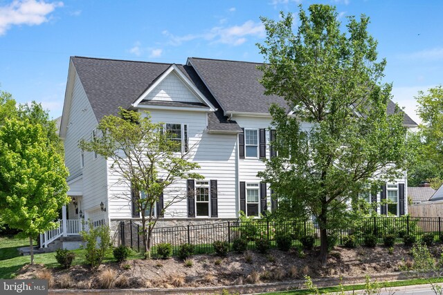 4950 34th St N, Arlington, VA 22207 - view of front facade featuring a fenced front yard and roof with shingles