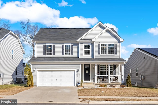 7269 Liberty Ct, Ruther Glen, VA 22546 - traditional-style home featuring central AC unit, driveway, a porch, and a garage