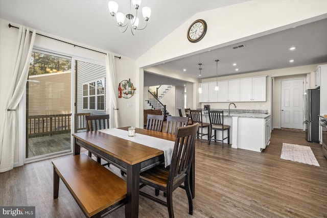 7269 Liberty Ct, Ruther Glen, VA 22546 - dining room with an inviting chandelier, visible vents, lofted ceiling, and dark wood-style floors