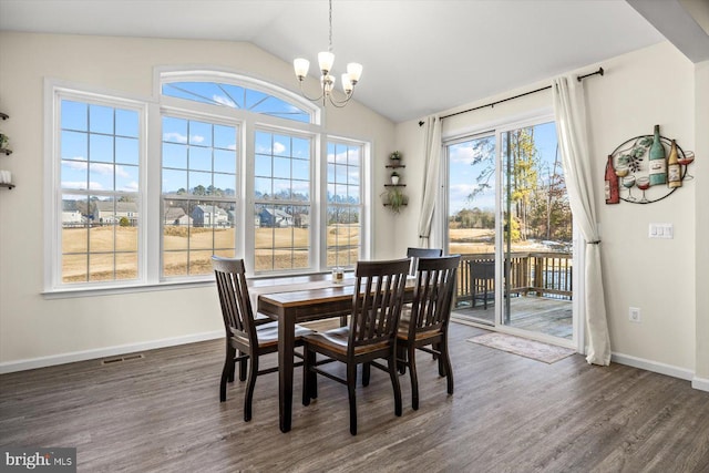 7269 Liberty Ct, Ruther Glen, VA 22546 - dining room with a healthy amount of sunlight, dark wood finished floors, a chandelier, and visible vents