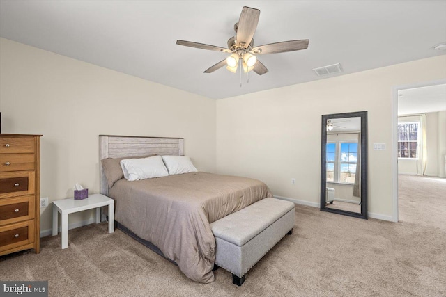7269 Liberty Ct, Ruther Glen, VA 22546 - bedroom with ceiling fan, light carpet, baseboards, and visible vents