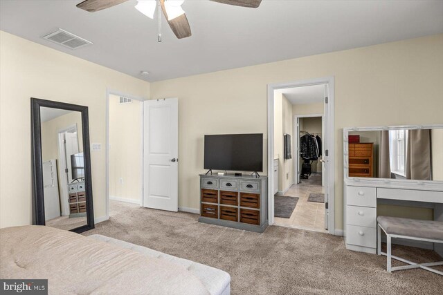 7269 Liberty Ct, Ruther Glen, VA 22546 - carpeted bedroom featuring baseboards, ceiling fan, and visible vents