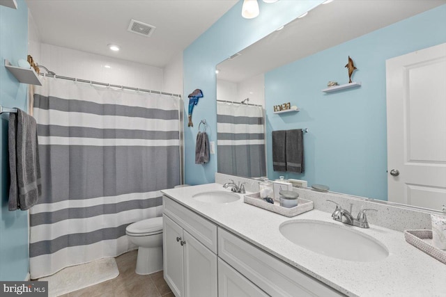 7269 Liberty Ct, Ruther Glen, VA 22546 - full bath with toilet, visible vents, a sink, and double vanity