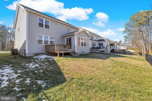 7269 Liberty Ct, Ruther Glen, VA 22546 - back of house featuring crawl space, a deck, a lawn, central air condition unit, and a fenced backyard
