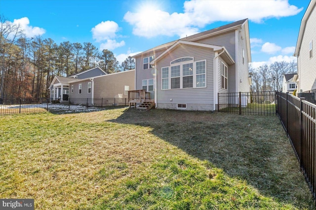 7269 Liberty Ct, Ruther Glen, VA 22546 - back of property featuring a yard, a deck, and a fenced backyard