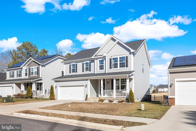 7269 Liberty Ct, Ruther Glen, VA 22546 - view of front of house with driveway, fence, covered porch, an attached garage, and a front yard