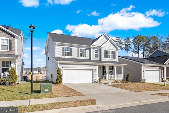 7269 Liberty Ct, Ruther Glen, VA 22546 - traditional-style house featuring covered porch, concrete driveway, an attached garage, and a front yard