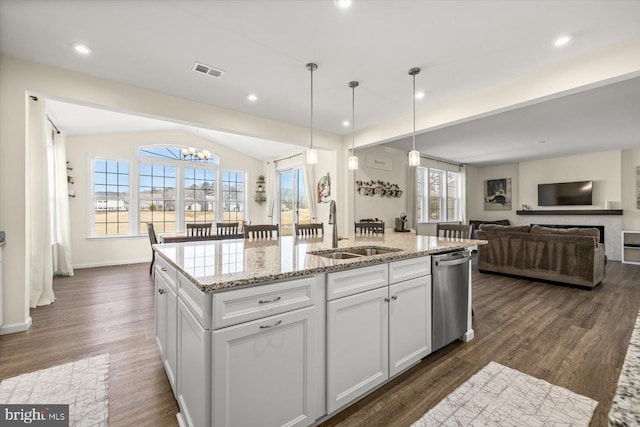 7269 Liberty Ct, Ruther Glen, VA 22546 - kitchen featuring a sink, open floor plan, stainless steel dishwasher, visible vents, and light stone countertops
