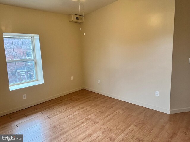 1921 W Diamond St, Philadelphia, PA 19121 - empty room featuring baseboards and light wood-type flooring