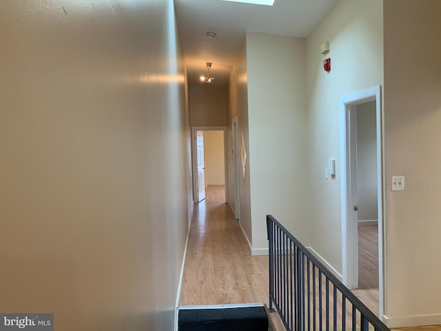 1921 W Diamond St, Philadelphia, PA 19121 - corridor with light wood finished floors, baseboards, and an upstairs landing