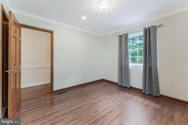 142 N French St, Alexandria, VA 22304 - empty room featuring wood finished floors, baseboards, ornamental molding, and recessed lighting
