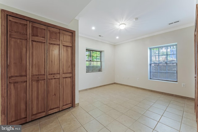 142 N French St, Alexandria, VA 22304 - unfurnished bedroom with crown molding, baseboards, light tile patterned floors, and recessed lighting