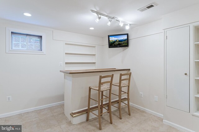 142 N French St, Alexandria, VA 22304 - bar area with built in features, baseboards, rail lighting, and recessed lighting