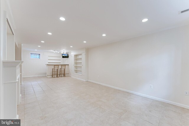 142 N French St, Alexandria, VA 22304 - unfurnished living room featuring built in features, recessed lighting, baseboards, bar area, and light tile patterned flooring