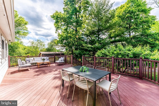 142 N French St, Alexandria, VA 22304 - wooden deck featuring outdoor lounge area, outdoor dining area, and view of scattered trees