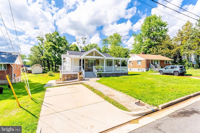 142 N French St, Alexandria, VA 22304 - bungalow with a porch, a front yard, a storage shed, and an outdoor structure