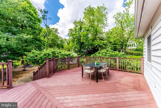 142 N French St, Alexandria, VA 22304 - wooden terrace with outdoor dining space and view of scattered trees