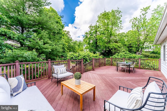 142 N French St, Alexandria, VA 22304 - wooden deck featuring outdoor dining area and view of wooded area