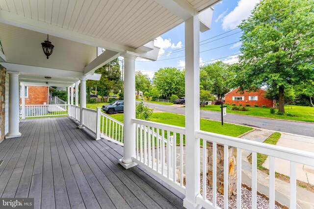 142 N French St, Alexandria, VA 22304 - wooden terrace with a porch and a lawn