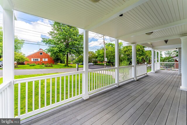 142 N French St, Alexandria, VA 22304 - wooden deck with covered porch and a lawn