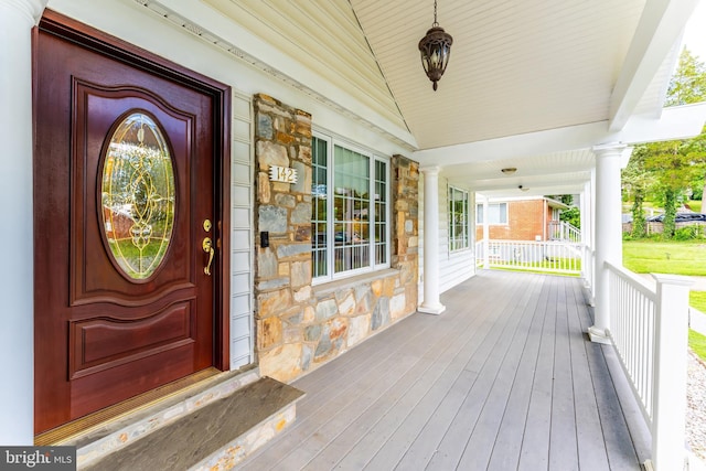 142 N French St, Alexandria, VA 22304 - view of exterior entry featuring stone siding and a porch