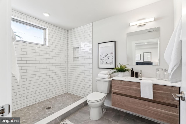 full bathroom featuring visible vents, vanity, a shower stall, and toilet