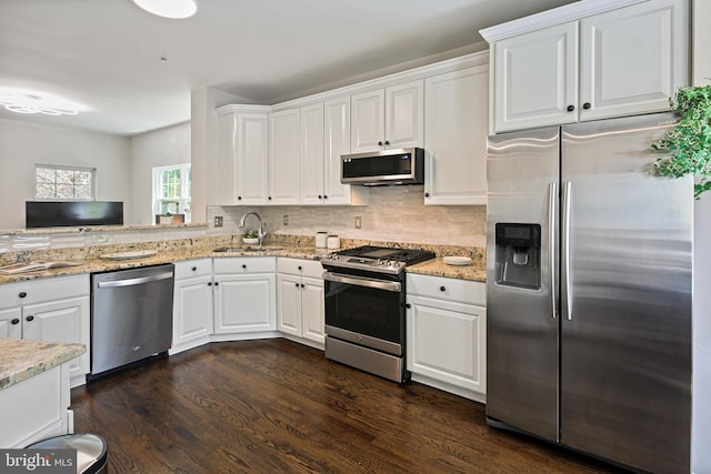 6129 White Marble Ct, Clarksville, MD 21029 - kitchen with white cabinets, stainless steel appliances, dark wood-style floors, and a sink