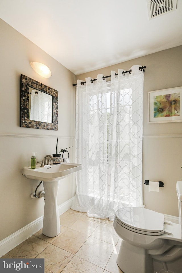 6129 White Marble Ct, Clarksville, MD 21029 - full bathroom with visible vents, marble finish floor, baseboards, and toilet