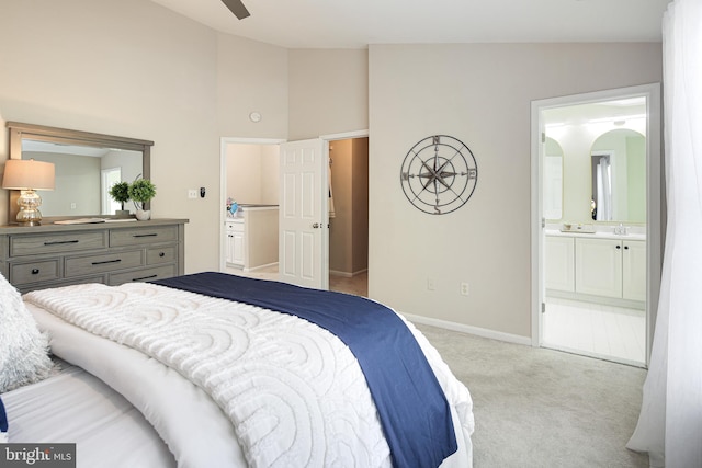 6129 White Marble Ct, Clarksville, MD 21029 - bedroom with light carpet, a sink, connected bathroom, baseboards, and high vaulted ceiling