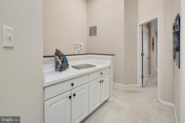 6129 White Marble Ct, Clarksville, MD 21029 - corridor with visible vents, baseboards, and light carpet
