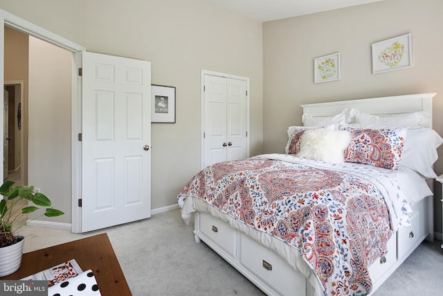 6129 White Marble Ct, Clarksville, MD 21029 - bedroom with a closet, baseboards, and light carpet