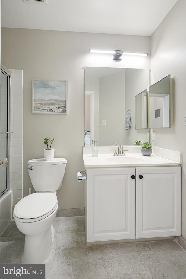 6129 White Marble Ct, Clarksville, MD 21029 - full bath featuring vanity, baseboards, enclosed tub / shower combo, toilet, and visible vents