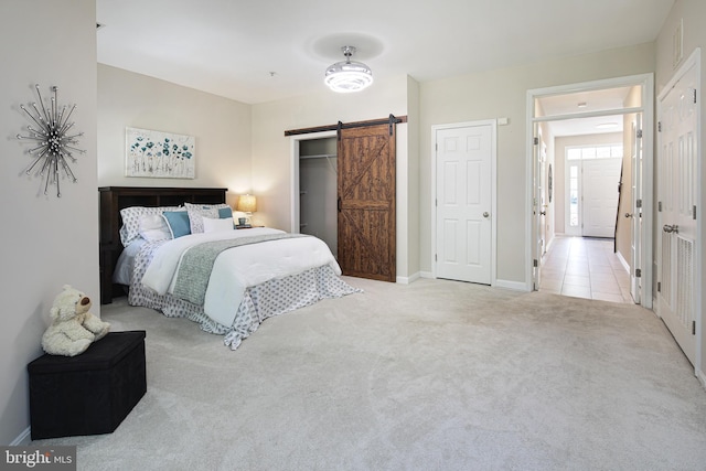 6129 White Marble Ct, Clarksville, MD 21029 - bedroom with visible vents, baseboards, carpet, and a barn door