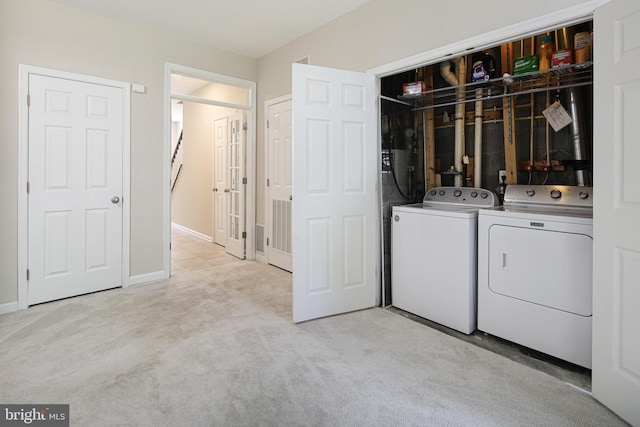 6129 White Marble Ct, Clarksville, MD 21029 - laundry room featuring washing machine and dryer, baseboards, carpet, and laundry area