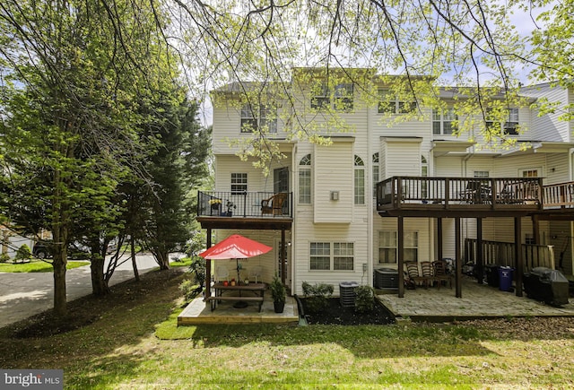 6129 White Marble Ct, Clarksville, MD 21029 - back of property with a balcony, a yard, central air condition unit, and a patio