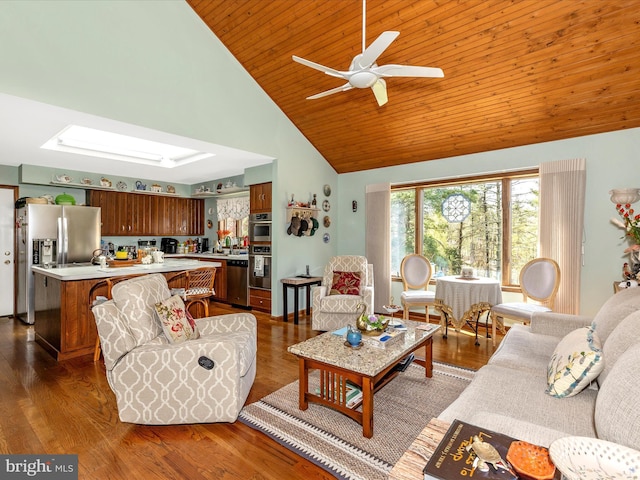 10334 Harp Rd, Walkersville, MD 21793 - living area featuring high vaulted ceiling, a skylight, ceiling fan, wooden ceiling, and dark wood-type flooring